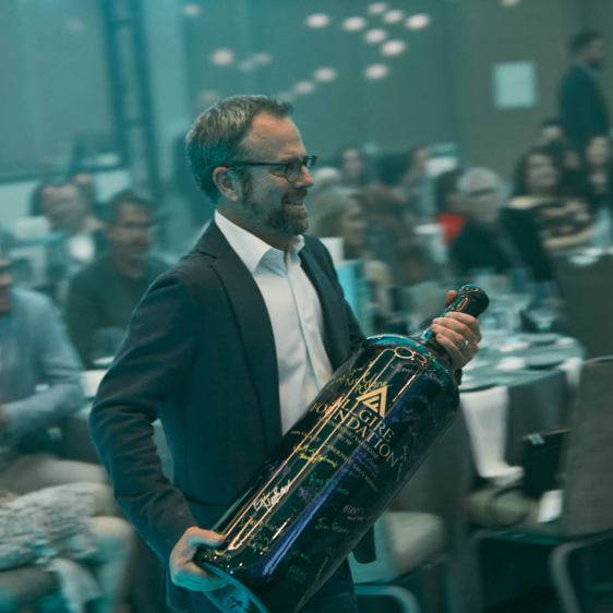 Man with large bottle of champagne