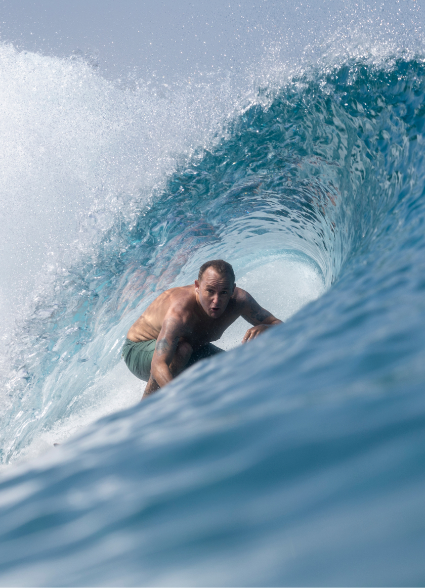 Photo of a man surfing at the Kelly Slater Surf Ranch Trip 