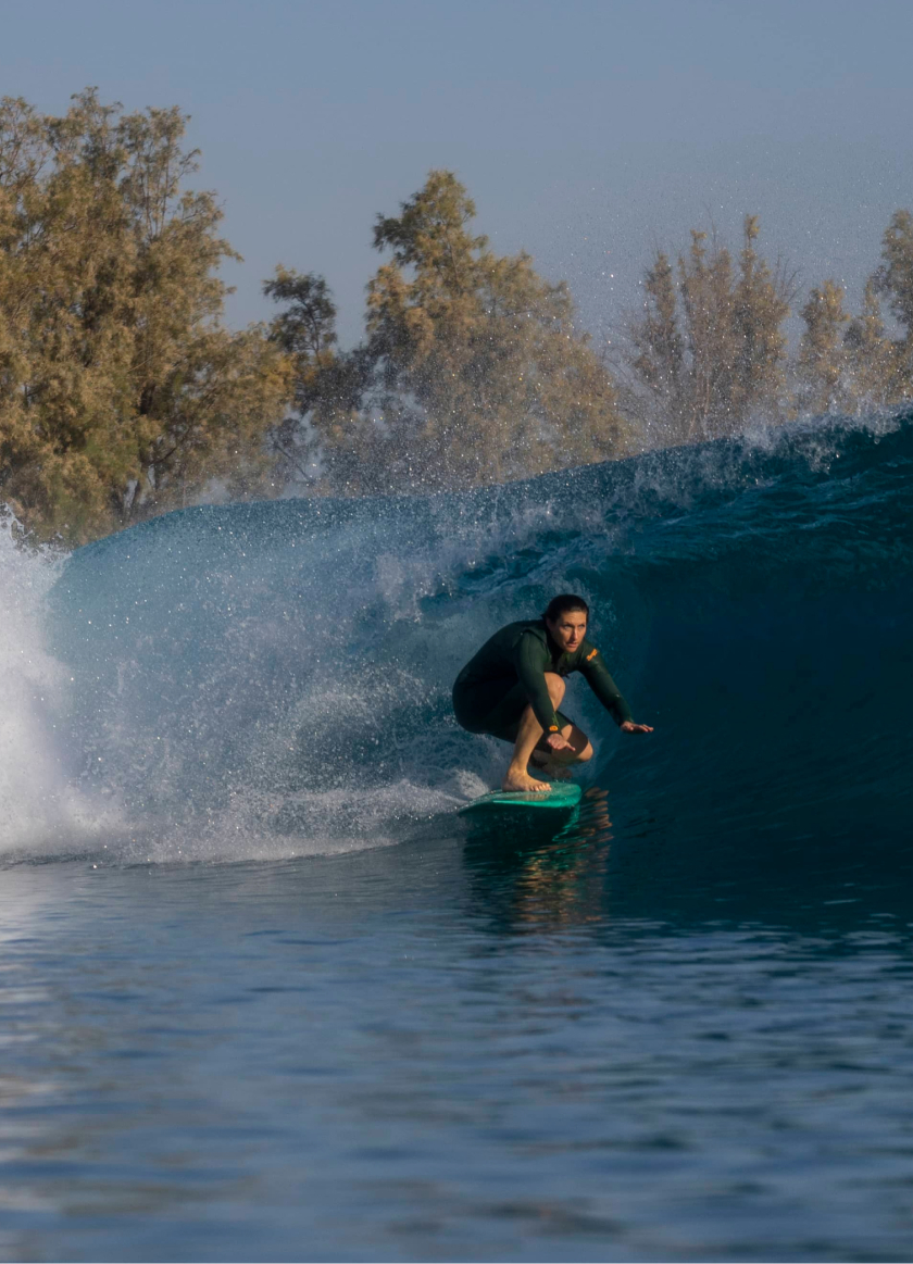 Photo of a person surfing a wave at the Kelly Slater Surf Ranch Trip