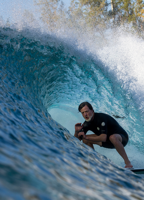 Photo of a man surfing at the Kelly Slater Surf Ranch Trip
