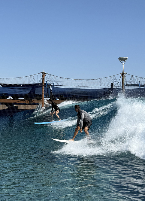 Close up photograph of a man surfing at the Kelly Slater Surf Ranch Trip