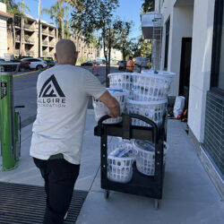 Man pushing a cart full of supplies