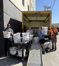 Volunteers unloading supplies from a truck