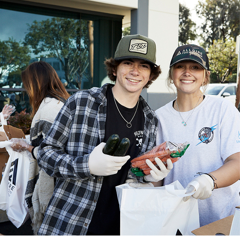 A photograph of two young volunteers smiling at Spring Harvest 2022