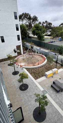 A fountain and plaza out front of City Heights