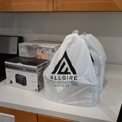 A bag of kitchen supplies on a counter in an Allgire Foundation bag