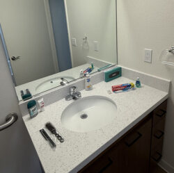 A bathroom sink with supplies